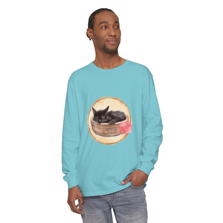 A watercolor illustration of a cute sleeping cat in a bowl on a long sleeve t-shirt