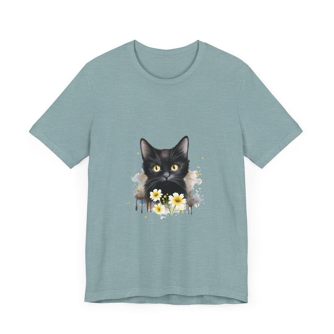 Black cat with piercing yellow eyes poses on a comfortable t-shirt