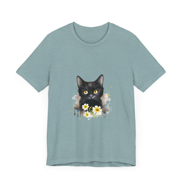 Black cat with piercing yellow eyes poses on a comfortable t-shirt