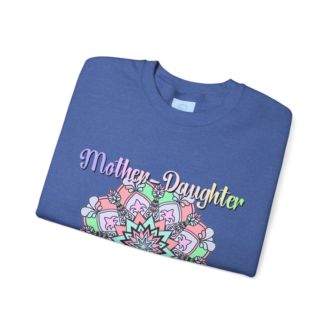 Mother and daughter embracing on a cozy unisex crewneck sweatshirt, the perfect birthday gift for mom to celebrate the unbreakable bond between them