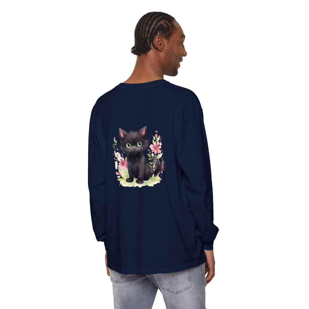 A cute and playful kitten surrounded by colorful floral watercolor designs on a t-shirt