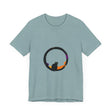 A black cat with glowing eyes stands in front of a large full moon, creating a spooky and stylish scene on the Black Cat Mystery Moon T-Shirt