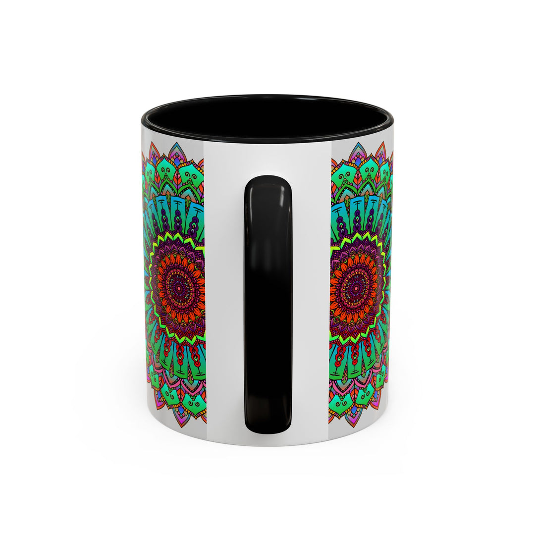 Handcrafted ceramic mug with a light grey background and colorful mandala art design