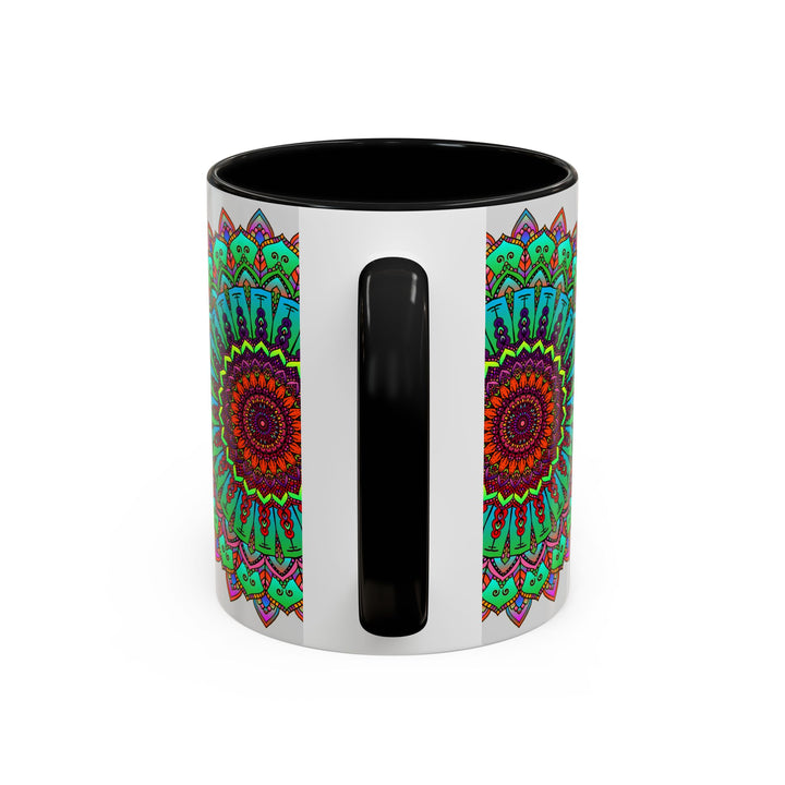 Handcrafted ceramic mug with a light grey background and colorful mandala art design