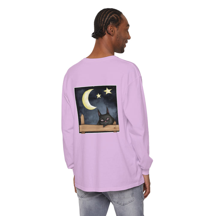 A comfortable black t-shirt featuring a sleepy cat under the night sky