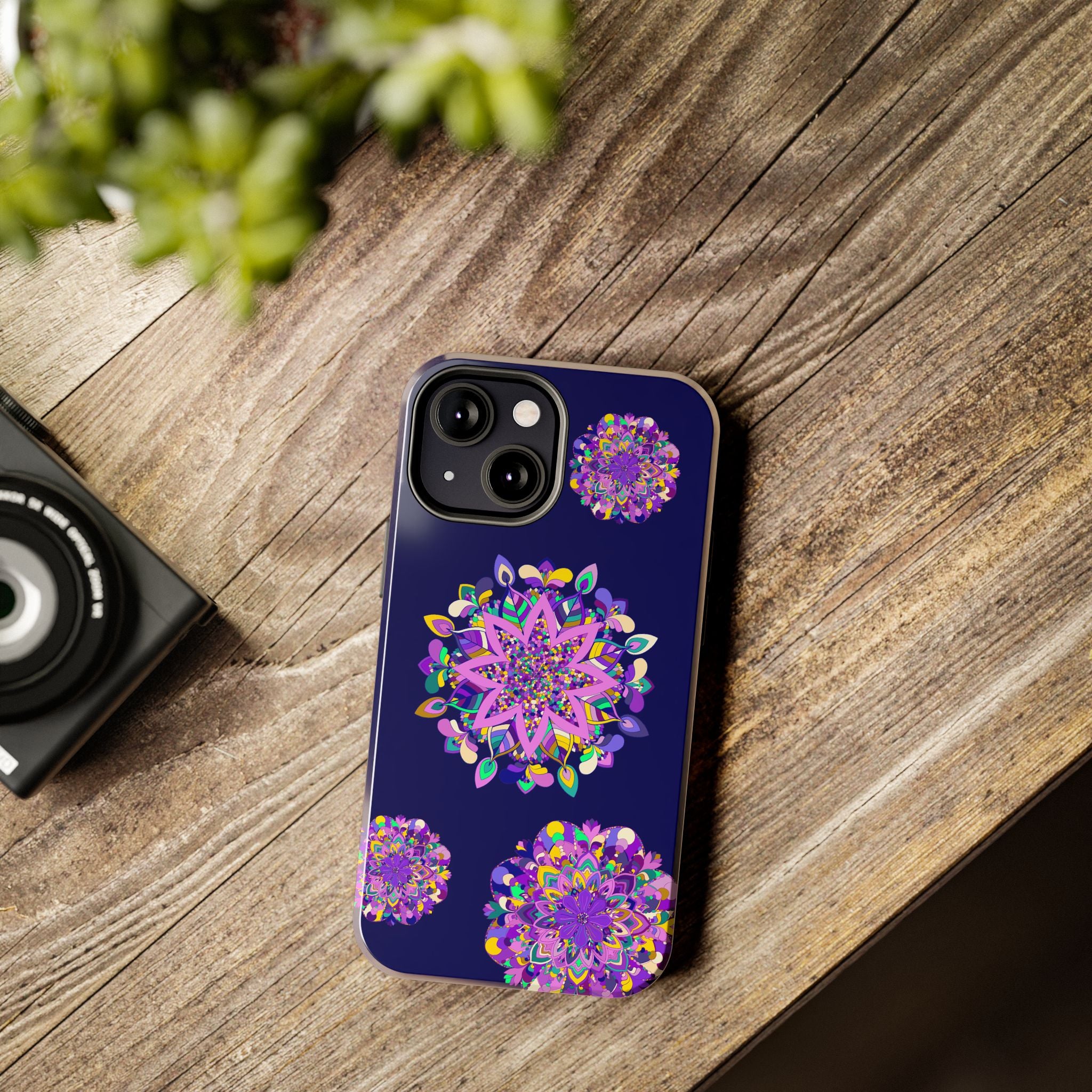 A durable and shock absorbent phone case featuring hand-drawn mandala art in purple shades