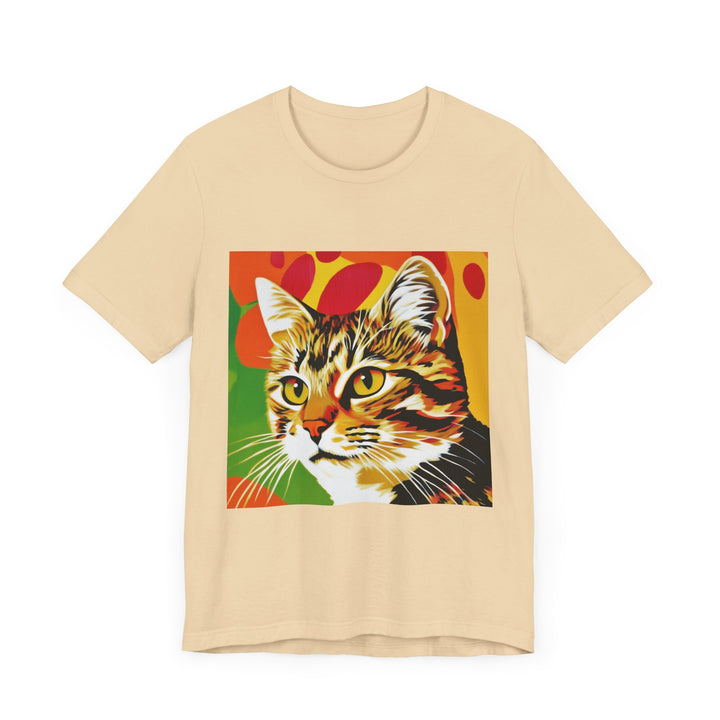 A colorful and vibrant short sleeve t-shirt featuring a pop art style illustration of a tabby cat