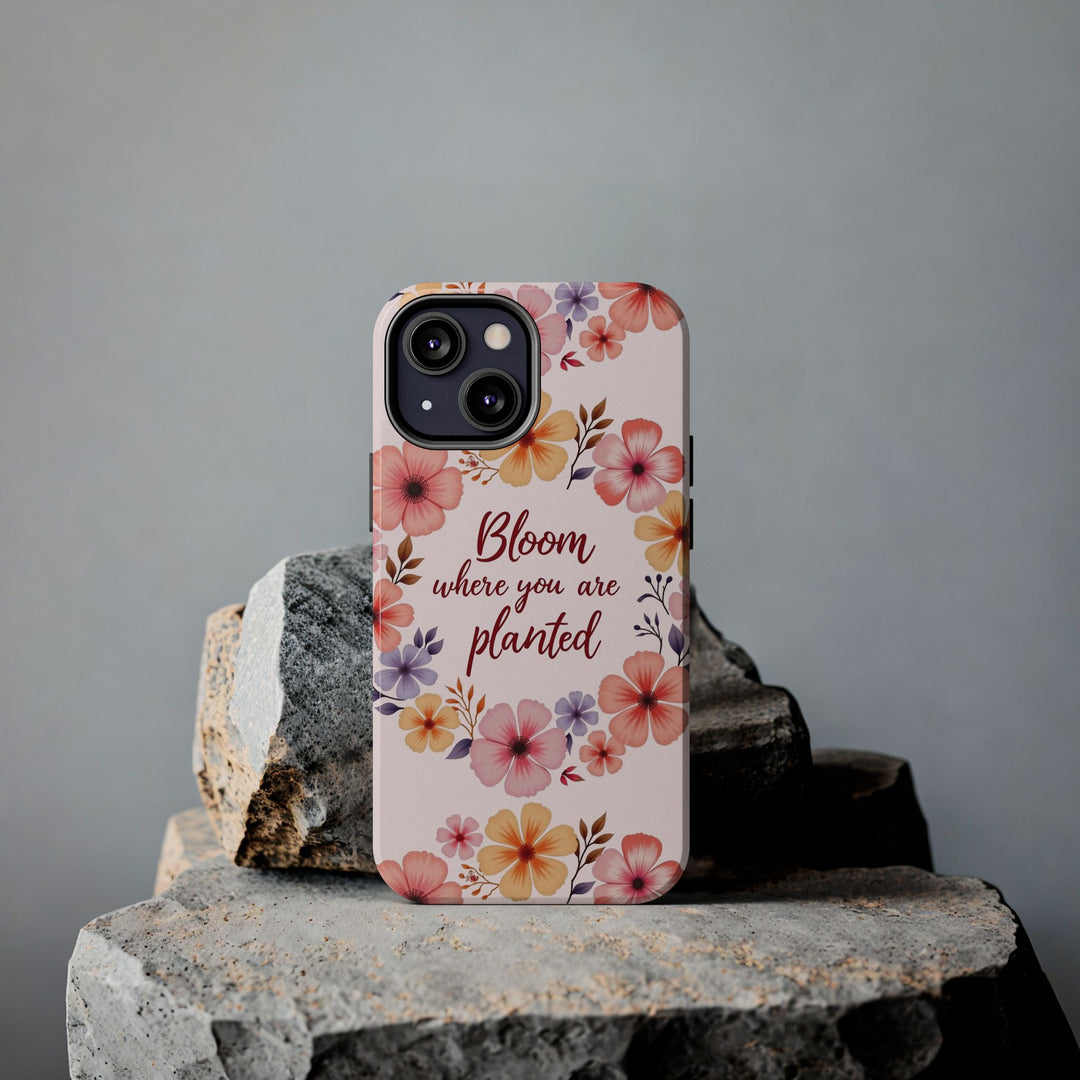 A light pink phone case with a flower garland bloom design