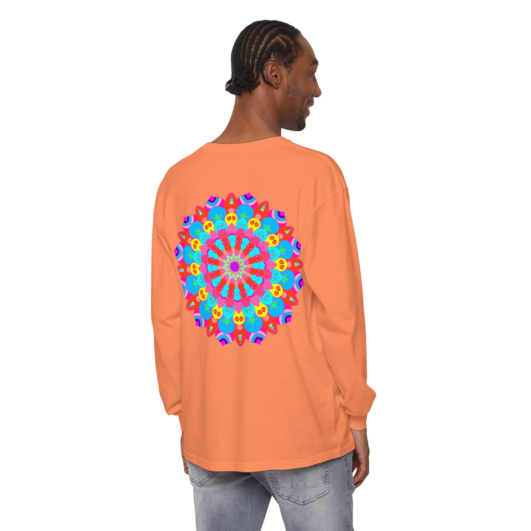 A vibrant and intricate mandala design adorns this unisex long sleeve t-shirt