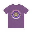 White t-shirt featuring a striking mandala design, promoting spiritual peace and harmony with intricate, colorful patterns and symbols