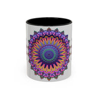 A close-up image of a grey ceramic mug with a vibrant mandala design