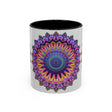 A close-up image of a grey ceramic mug with a vibrant mandala design