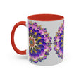 Handcrafted mandala art mug with vibrant colors on a grey background