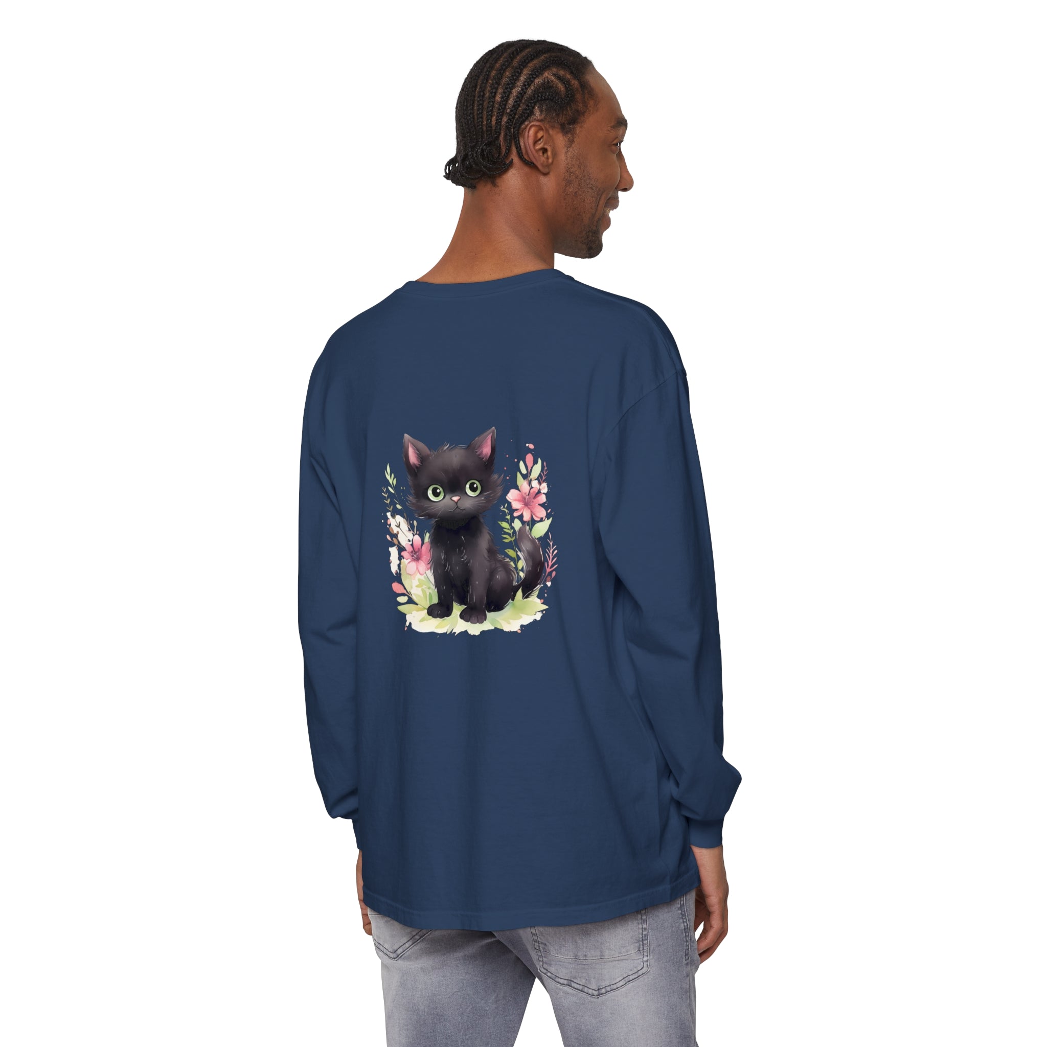 White t-shirt with a playful kitten surrounded by vibrant floral watercolor designs