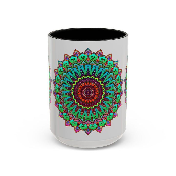 A light grey ceramic mug featuring a colorful mandala art design