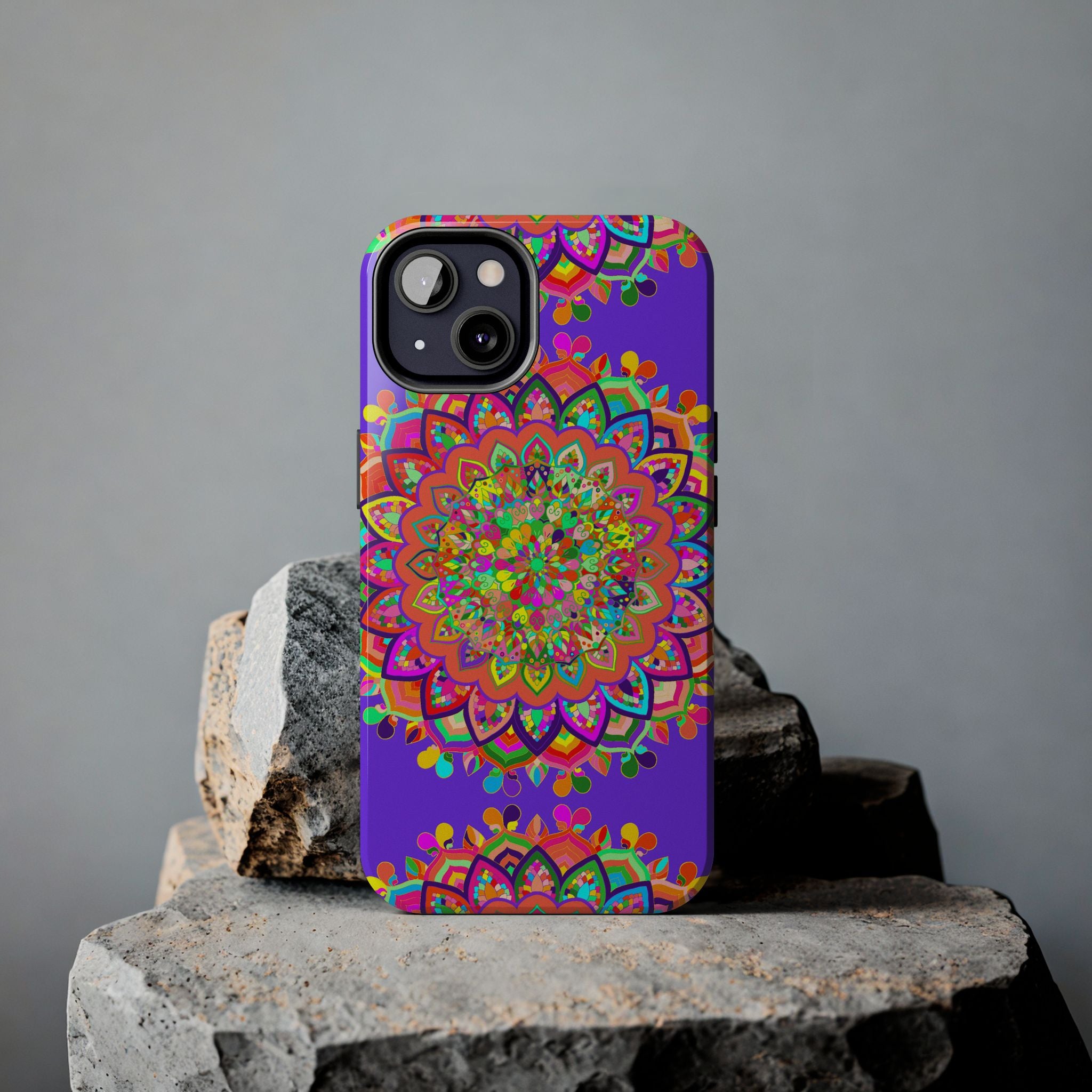 A hand-drawn purple mandala art phone case featuring intricate and detailed design