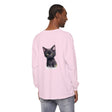 A charming black kitten with vibrant green eyes adorns this cute T-shirt