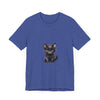 A playful and adorable grey kitten with bright blue eyes wearing a t-shirt with a cute design