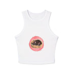 An adorable black cat sleeping peacefully on a racerback tank top