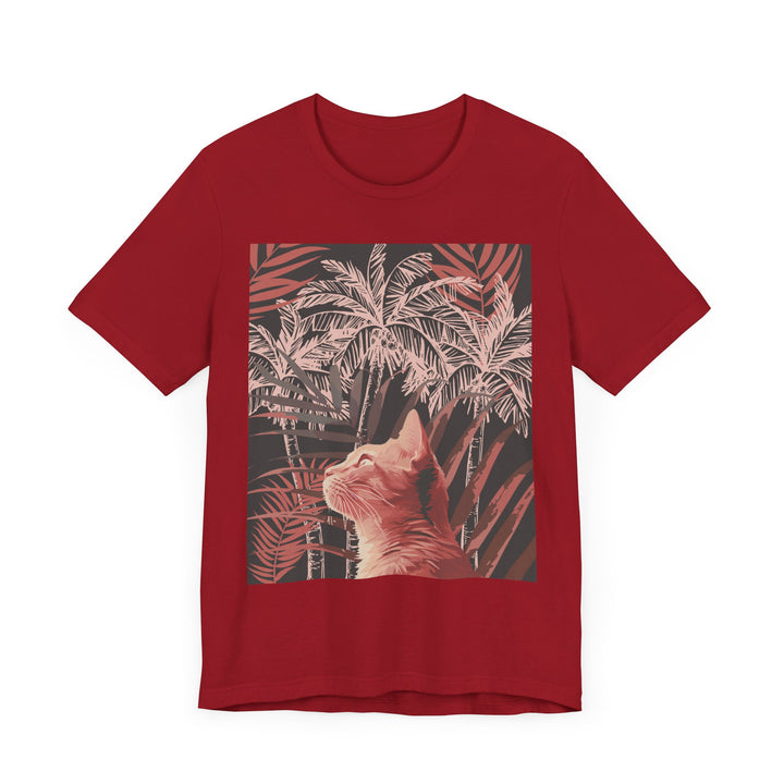 A charming ginger cat lounges beneath a lush palm tree on this stylish and comfortable tee