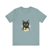 A close-up image of a black cat with piercing yellow eyes printed on a t-shirt