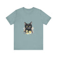 A close-up image of a black cat with piercing yellow eyes printed on a t-shirt