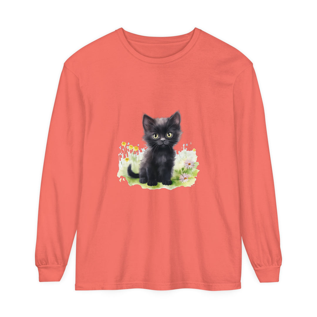 A cute black kitten playing in a vibrant flower garden printed on a long sleeve t-shirt