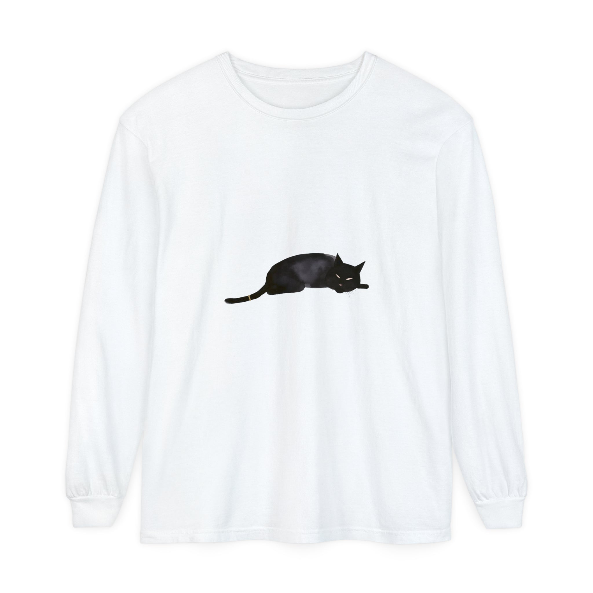 A cozy black cat curls up on a unisex long sleeve t-shirt, perfect for lounging or sleeping in comfort and style