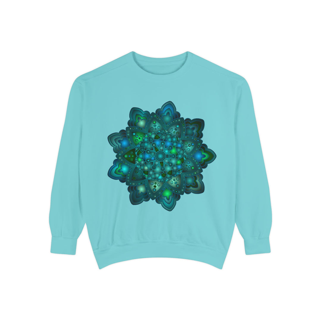 Close-up of a cozy sweatshirt featuring a detailed blue and green mandala design