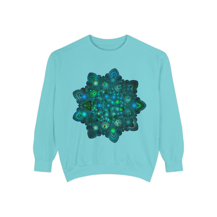 Close-up of a cozy sweatshirt featuring a detailed blue and green mandala design