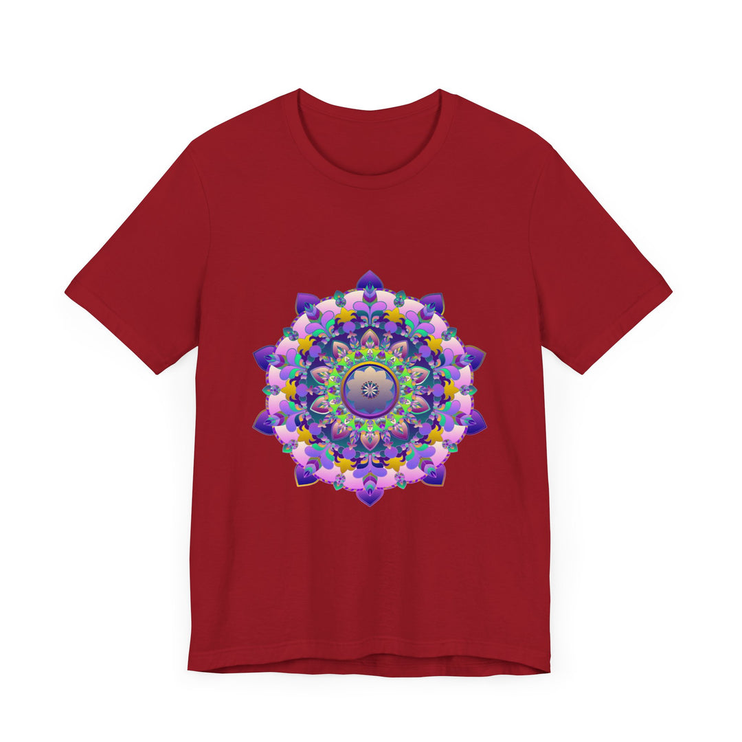 A close-up image of a vibrant mandala tee featuring intricate and colorful designs in shades of blue, green, red, and yellow