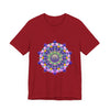 A close-up image of a vibrant mandala tee featuring intricate and colorful designs in shades of blue, green, red, and yellow