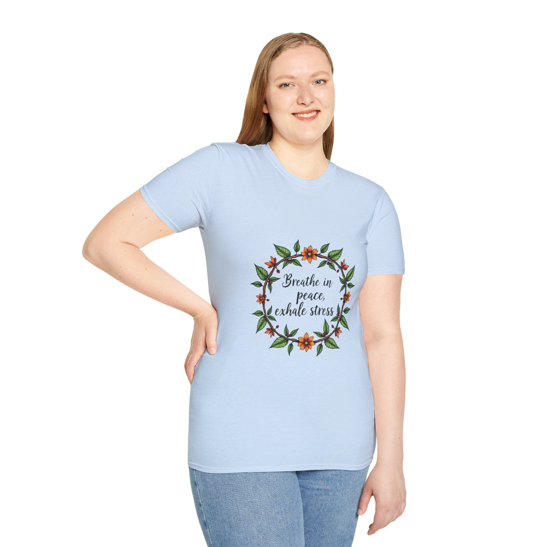 Close up of a white t-shirt with a floral garland design and the slogan 'Breathe in Peace Exhale Stress' printed in elegant script, perfect for embracing a sense of calm and tranquility in everyday life