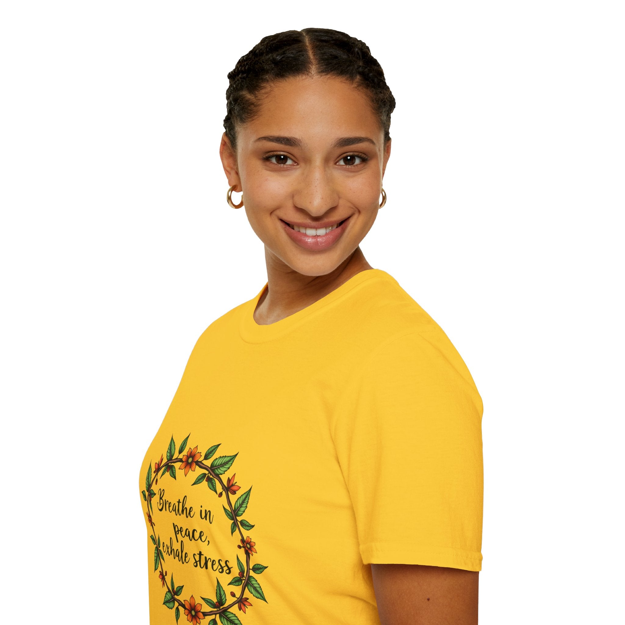 Close-up image of a white t-shirt with a floral garland design and the text 'Breathe in Peace Exhale Stress'