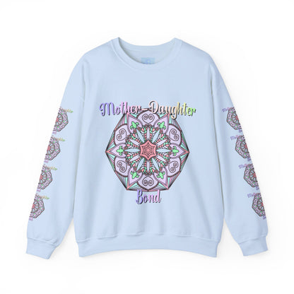 Mother and daughter embracing each other while wearing matching 'Mother-Daughter Bond' Unisex Heavy Blend™ Crewneck Sweatshirts, the perfect birthday gift for mom