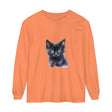 A close-up image of a black long sleeve unisex t-shirt with a mystical kitten design on the front