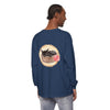 A watercolor illustration of a sleeping cat in a bowl printed on a long sleeve t-shirt