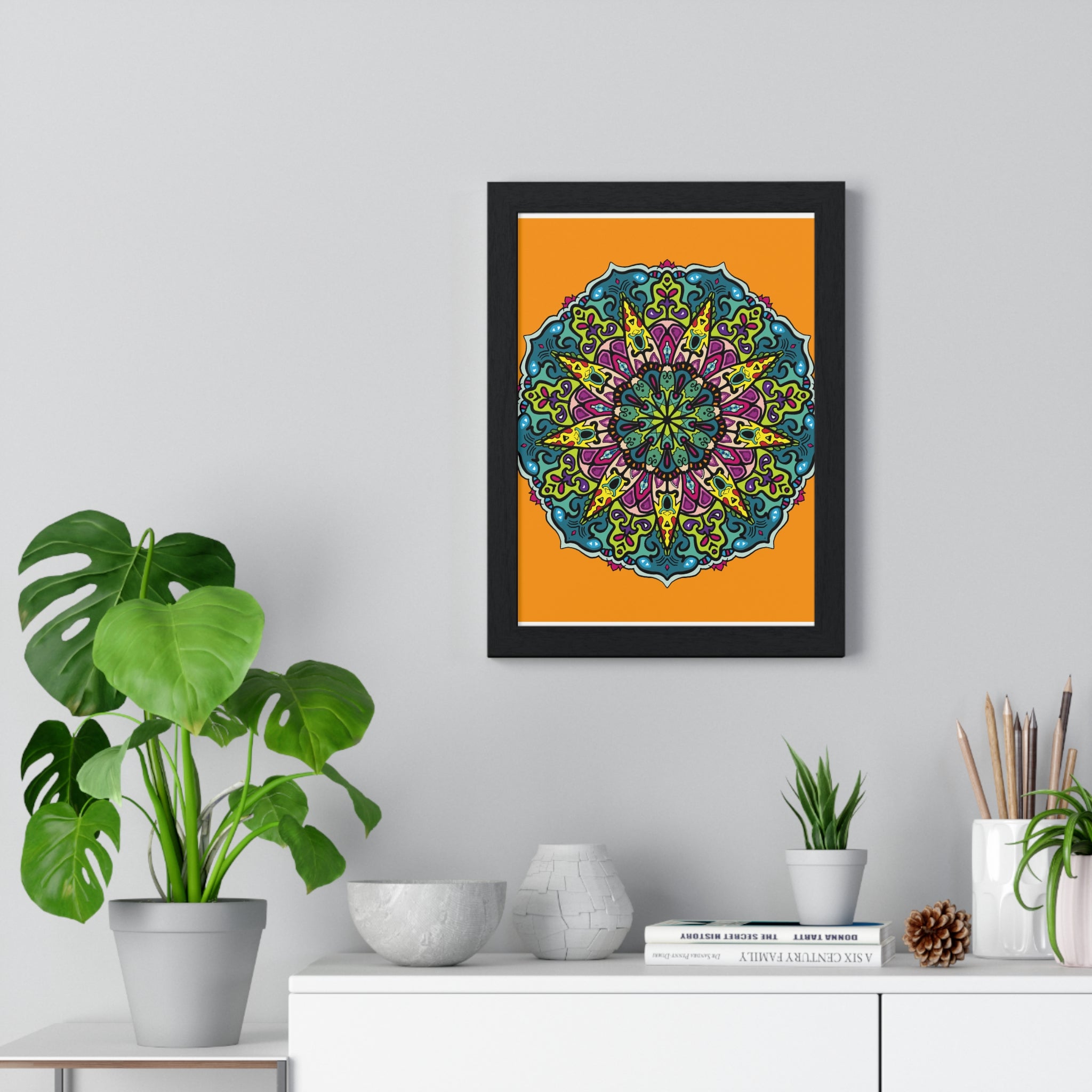 Vertical framed poster featuring a stunning hand-drawn orange mandala art