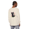 Adorable white kitten playing with colorful floral watercolor on t-shirt