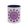 A close-up image of a ceramic mandala mug with a purple and pink floral design, perfect for enjoying your favorite hot drink