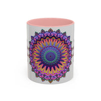 A grey ceramic mug with a vibrant mandala design, featuring intricate patterns and bright colors