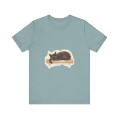 A cozy and adorable watercolor illustration of a black cat sleeping on a t-shirt