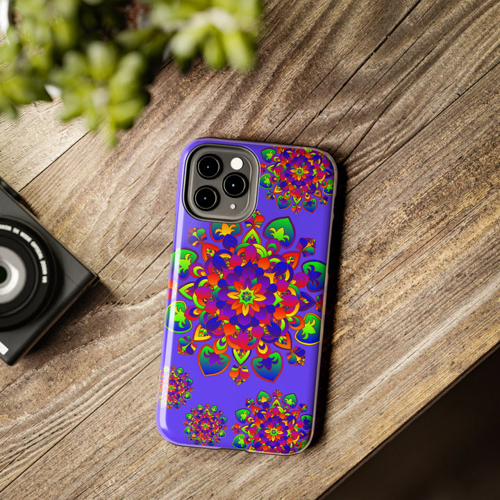 A colorful and intricate hand drawn mandala rainbow design phone case