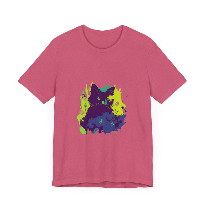 A black cat with glowing green eyes sits against a backdrop of swirling abstract patterns on a t-shirt