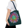 Dark green tote bag with intricate and colorful mandala design, perfect for carrying your essentials in style