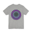 Colorful mandala tee featuring intricate spiritual symbols for peace and harmony
