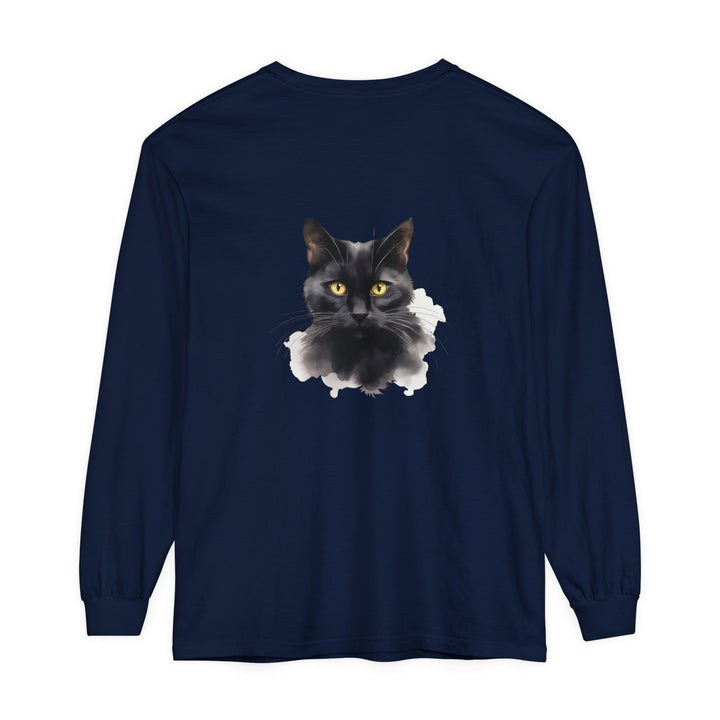 A close-up image of a black cat's face on a unisex long sleeve t-shirt