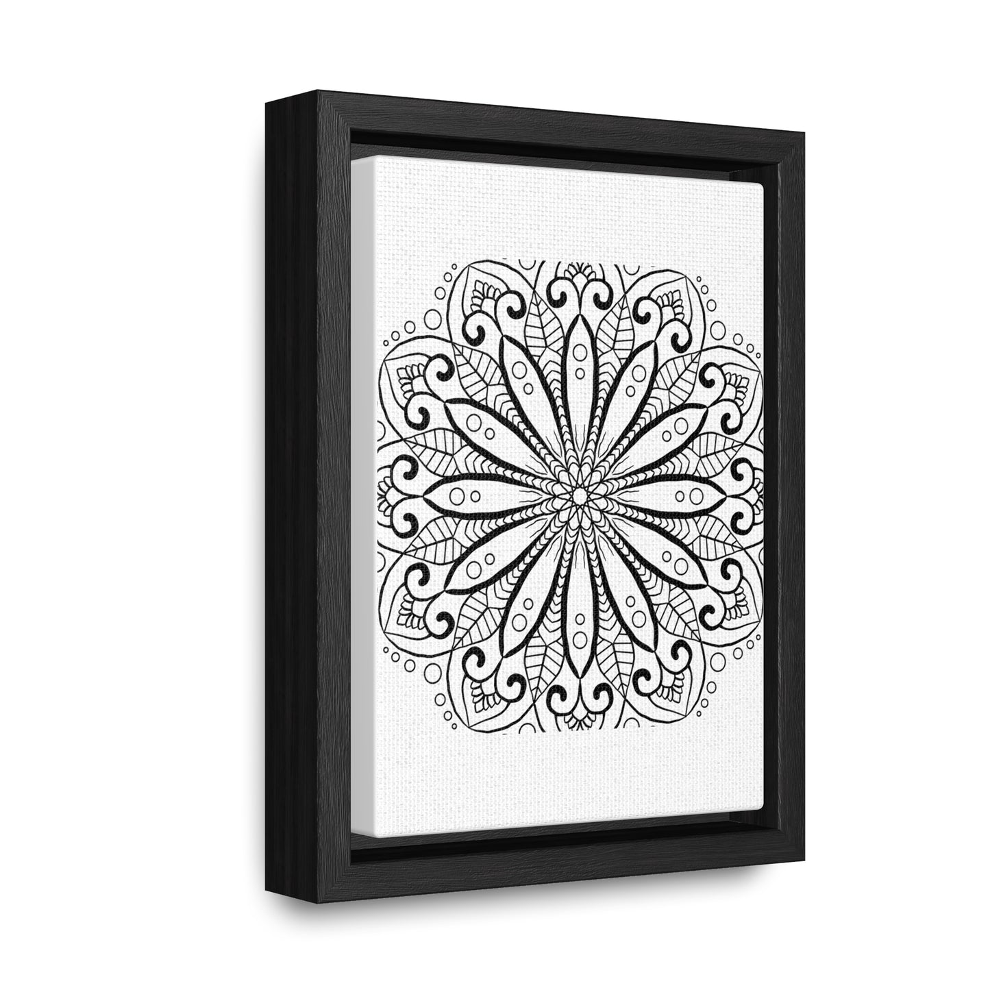 Handmade mandala art in black and white, displayed on gallery canvas wraps in a vertical frame