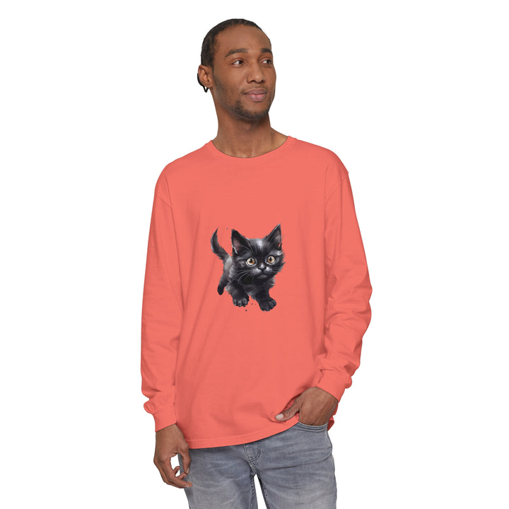 A watercolor illustration of a playful kitten printed on a vibrant T-shirt