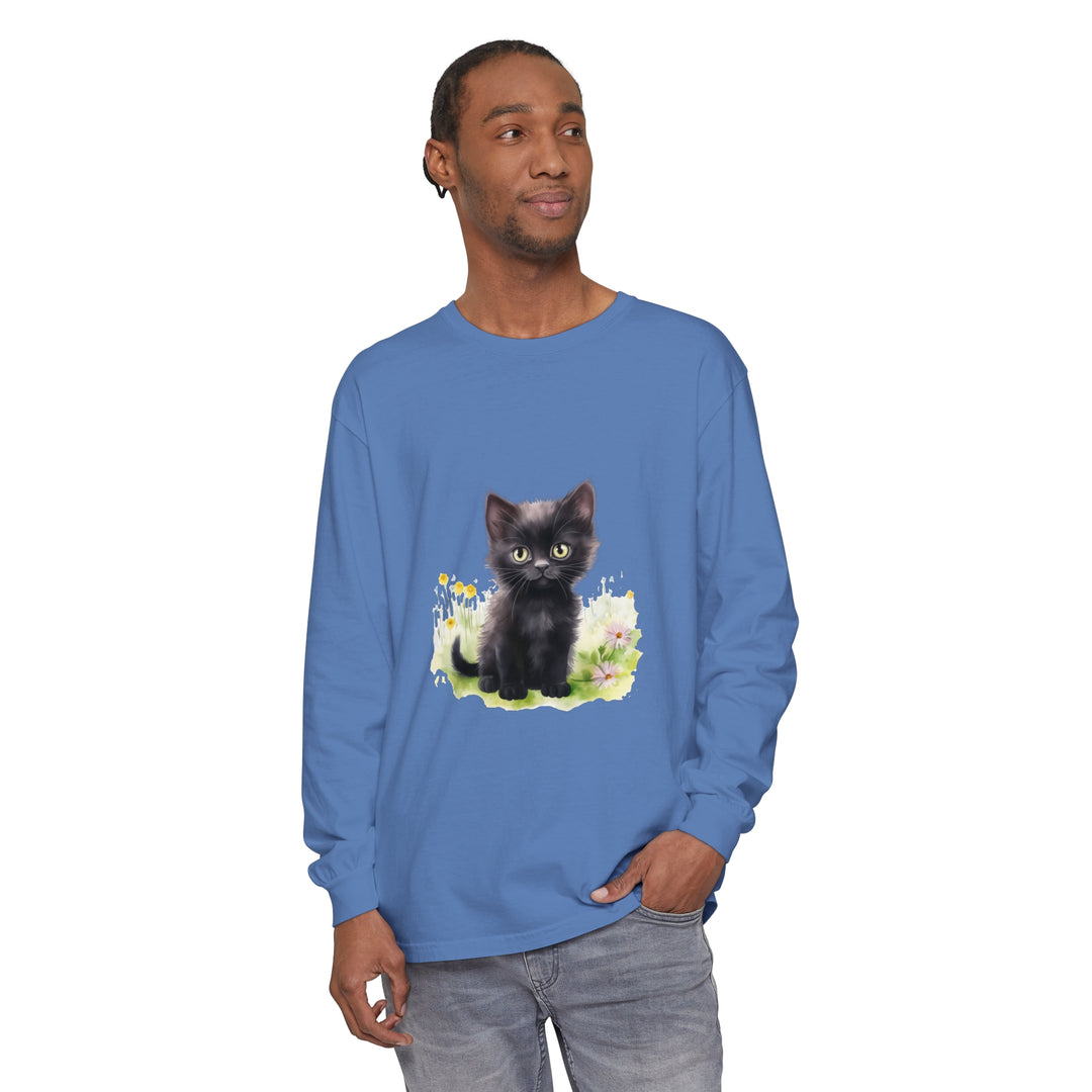 Adorable black kitten exploring a colorful flower garden on a long sleeve t-shirt